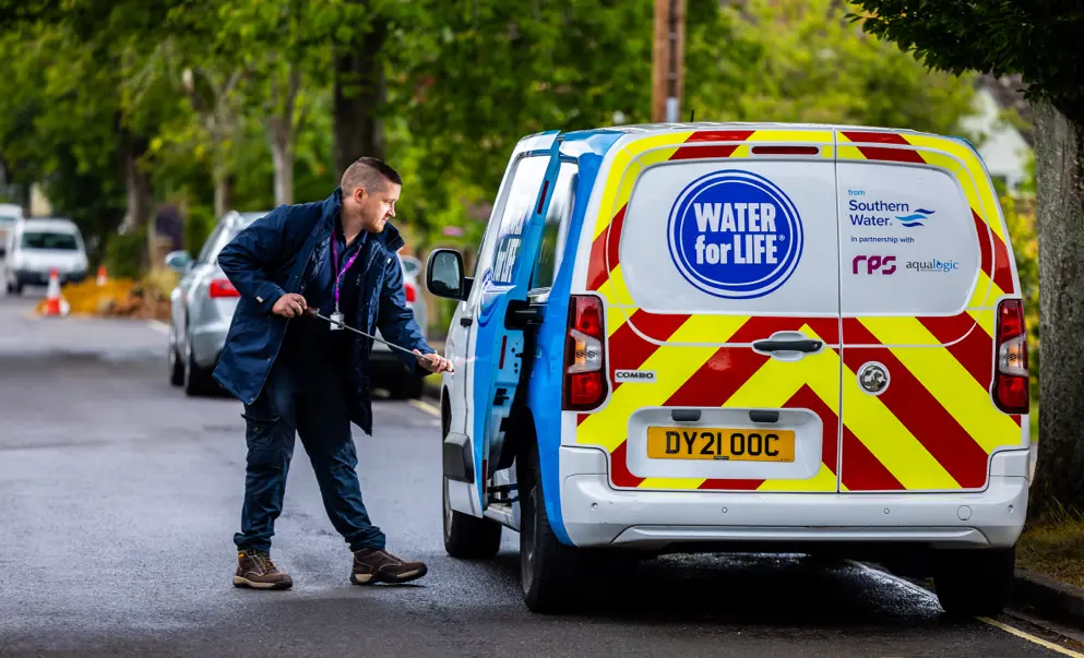 A southern water employee putting equipment back into their truck