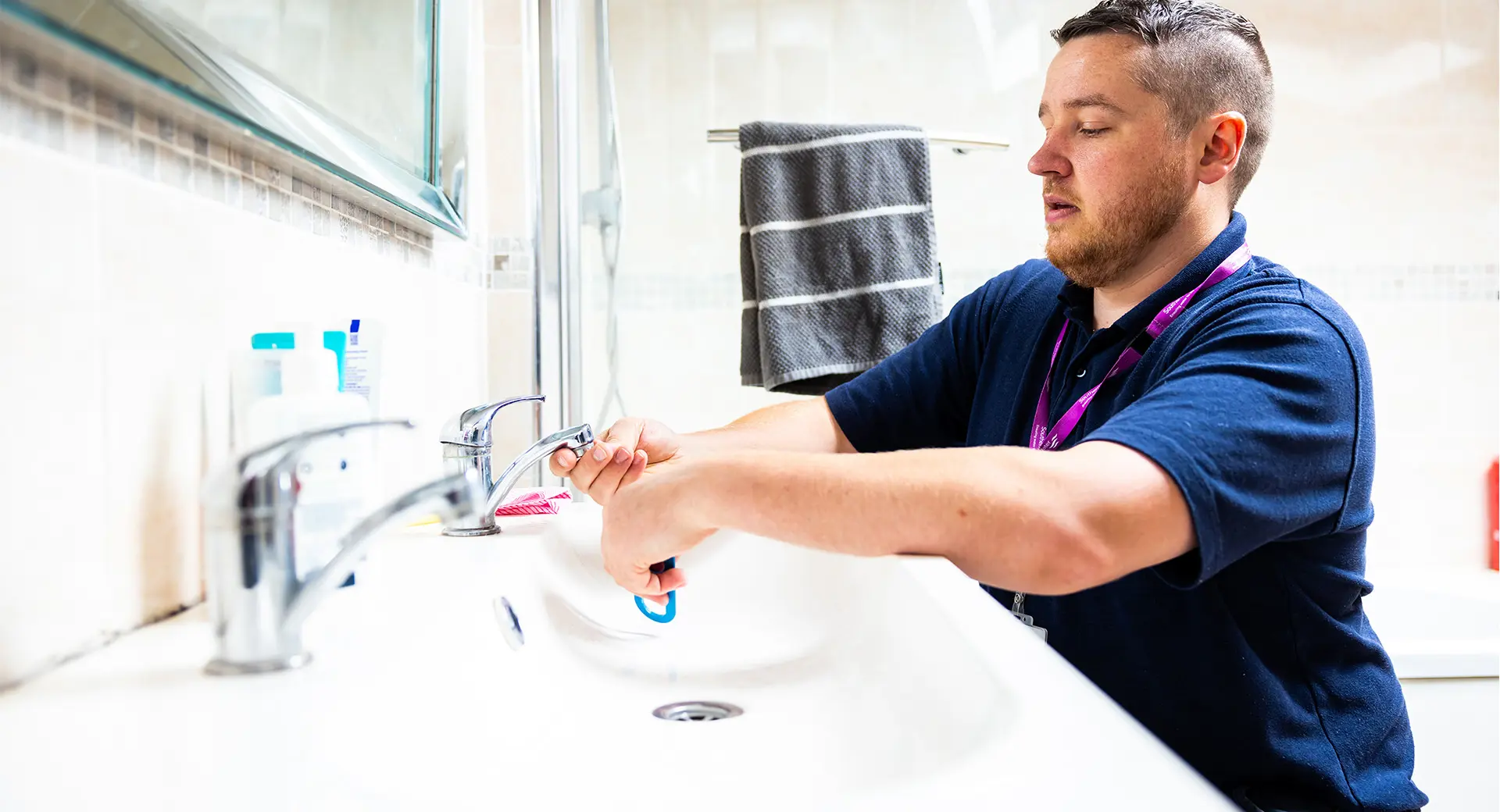 Worker fixing a tap