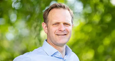 A headshot of Stuart Ledger