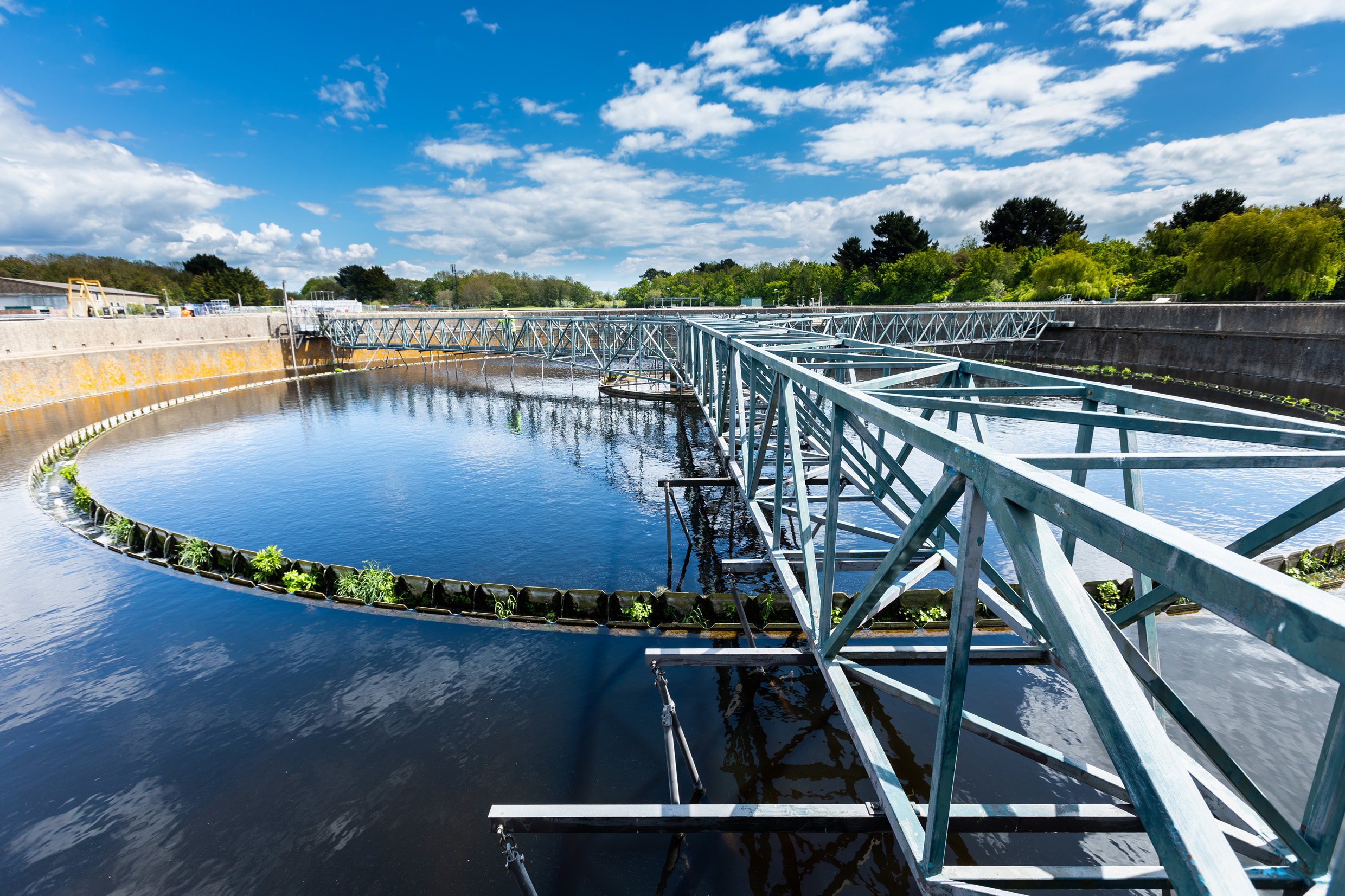 A circular clarifier at the Peel Common Wastewater Treatment Works on a sunny day